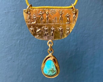 Figures in a frieze with turquoise drop pendant