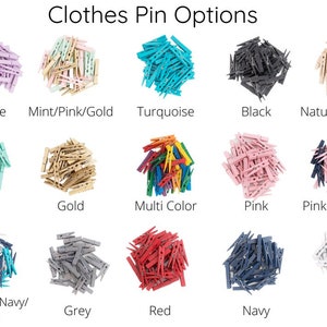 May include: Assortment of colourful wooden clothes pegs in various colours, including purple, mint, gold, turquoise, black, natural wood, pink, navy, grey, red, and white.