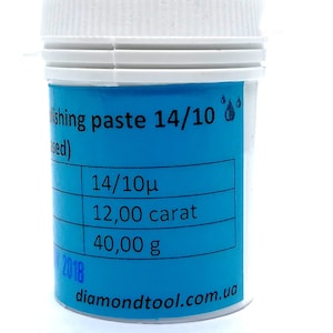 May include: A white plastic jar with a blue label. The label says "Polishing paste 14/10" and has the following information: 14/10µ, 12.00 carat, 40.00 g, diamondtool.com.ua.
