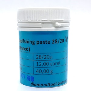 May include: A blue plastic jar with a white lid labelled "polishing paste 28/20 Based)" and a table listing "28/20μ", "12,00 carat", and "40,00 g". The bottom of the jar has the website "diamondtool.com.ua" and the date "NOV 2018".