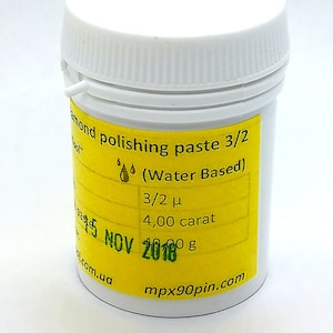 May include: A white plastic jar with a yellow label that reads "Diamond polishing paste 3/2 (Water Based)" and includes the text "3/2 μ", "4,00 carat", "40,00 g", "15 NOV 2018", "mpx90pin.com", and "com.ua".