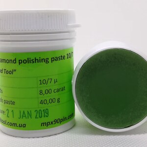 May include: A green diamond polishing paste in a white jar with a green label. The label reads "Diamond polishing paste 10/7", "Diamond Tool", "10/7 μ", "8,00 carat", "40,00 g", "21 JAN 2019", "tool.com.ua", and "mpx90pin.com".