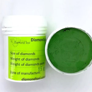 May include: A white jar with a green lid containing a green diamond paste. The jar has a label that says "Diamond Tool" and lists the size, weight, and date of manufacture of the paste. The label also includes the website address "diamondtool.com".