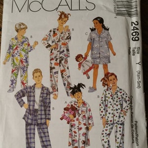 May include: A sewing pattern for pajamas for children. The pattern includes four different styles of pajamas, including a long-sleeved shirt and pants, a short-sleeved shirt and shorts, a long-sleeved dress, and a long-sleeved shirt and pants with a heart print. The pattern is for sizes X-Small to Small.