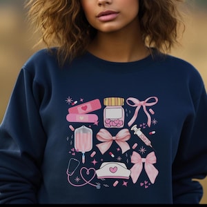 Pink Nurse Bow Sweatshirt, Medical Theme Sweater, Bows Needles Bandaids IV Bag, Cute Nurse Gift, Hospital Apparel, Nurse Sweater, Healthcare