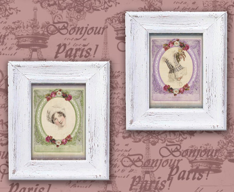 May include: Two white picture frames with ornate designs, each containing a vintage print of a woman in a white dress and a floral wreath. The background is a pink and white patterned wallpaper with the text "Bonjour Paris!" repeated.