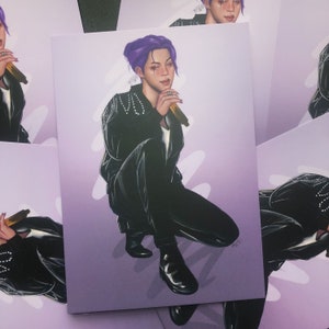 May include: A digital illustration of a person with purple hair wearing a black leather jacket and pants. The person is holding a microphone and is singing. The background is a light purple color.