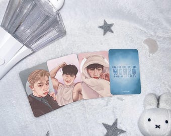 May include: Three photo cards featuring a man with brown hair and a white shirt, a man with black hair and a white shirt, and a blue card with the text "USA Fan Meet Up 2024 Wonho Chicago | 12.07.24"