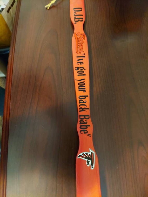 Wood back scratcher painted and designed with your choice of designs football teams, bulldogs,baseball.  Perfect man gift.Pick your color.