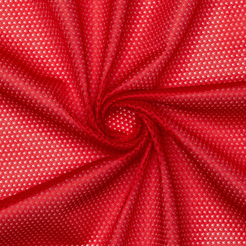 May include: Red mesh fabric with a small, repeating dot pattern. The fabric is gathered in the center, creating a swirling effect.