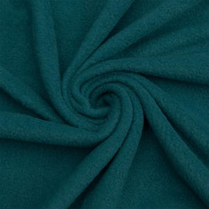 May include: A close-up of a teal blue fleece fabric. The fabric is soft and textured, with a slightly fuzzy appearance.