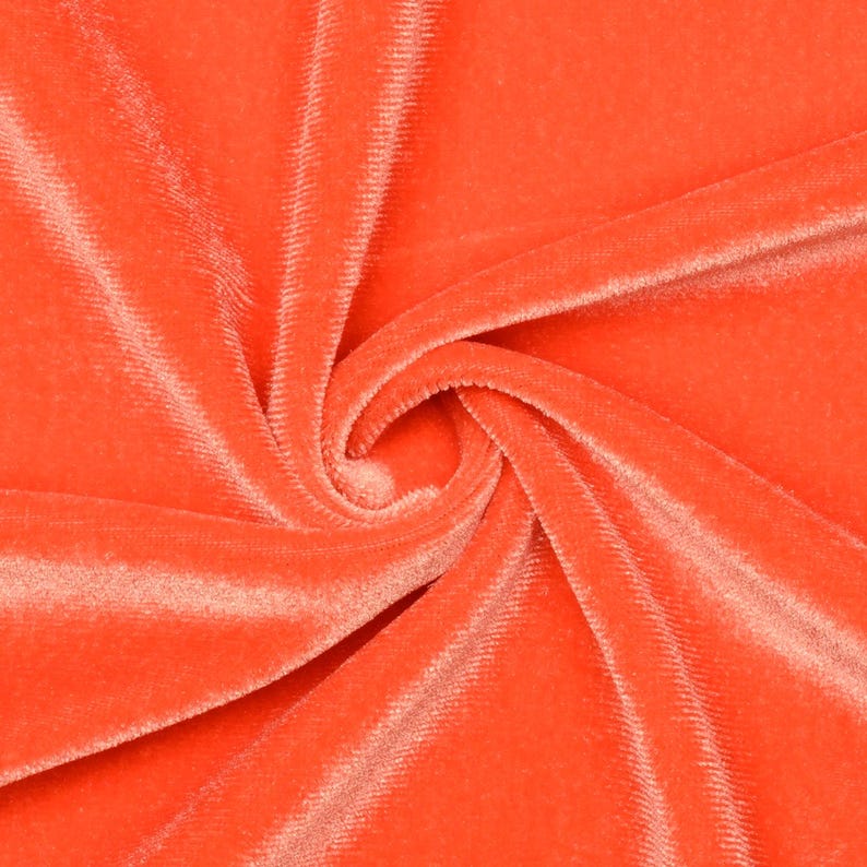 May include: Close-up of a bright orange velvet fabric, showing the texture and soft pile.