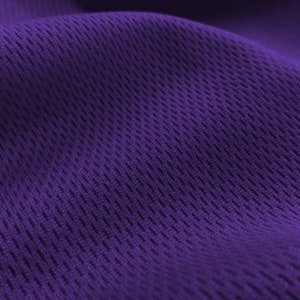 May include: Purple mesh fabric with a textured, diamond-shaped pattern.