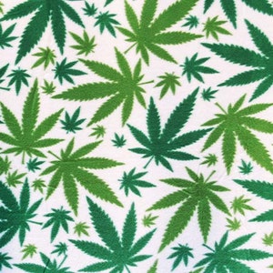 May include: A white background with a repeating pattern of green marijuana leaves of various sizes.