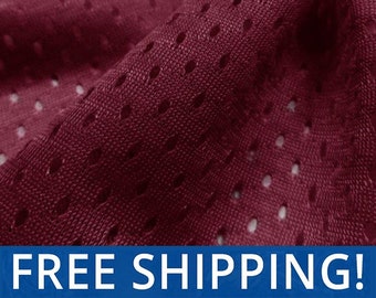 May include: Burgundy red mesh fabric with a small hole pattern. The fabric is soft and breathable.