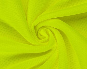 May include: A bright neon yellow fabric with a fine mesh texture, arranged in a swirling, gathered pattern that creates deep folds and shadows, highlighting the porous, lightweight quality of the synthetic material throughout the entire surface.