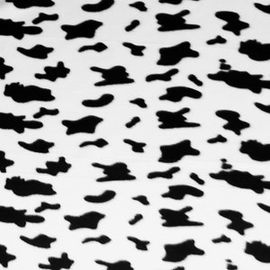 May include: Black and white abstract pattern with irregular shapes resembling animal print.