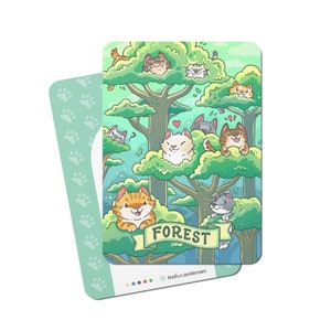 May include: A colourful illustration of a forest scene with cartoon cats in the trees. The card has a light green border with paw prints. The word "FOREST" is displayed on a banner. The artist's name is also visible.