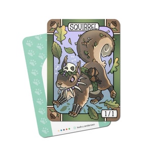 May include: A cartoon illustration of a squirrel with a skull on its head. The squirrel is brown with a bushy tail and is wearing a necklace of bones. The card is green and has the word "SQUIRREL" printed on it in a brown font. The card also has the number "1/1" printed on it in a white font.