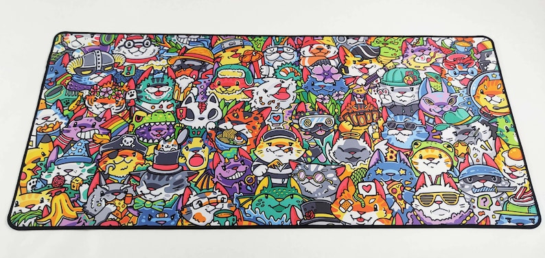 May include: A colorful mousepad featuring a repeating pattern of cartoon cats wearing various hats, sunglasses, and accessories. The cats are drawn in a whimsical style and are surrounded by a variety of other objects, including hearts, stars, and musical notes.