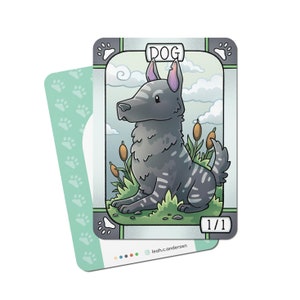 May include: A cartoon illustration of a gray and white dog sitting in a grassy field. The card is titled "DOG" and has a 1/1 rating. The card is part of a larger set of cards featuring different animals.
