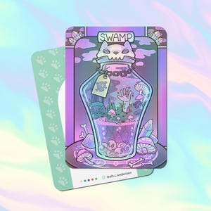 May include: A fantasy art print featuring a glass bottle labeled "SWAMP" with a cat-shaped stopper. Inside the bottle are skulls, a hand, and mushrooms. The print has a holographic background and a green card with paw prints.