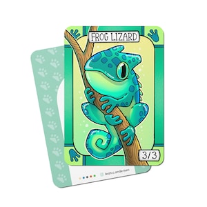 May include: A green and blue cartoon frog lizard with a large eye, perched on a brown branch. The card has the text "Frog Lizard" and "3/3" on it.