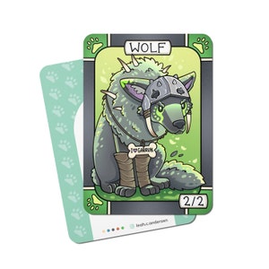 May include: A green and gray wolf card with a helmet and a bone necklace that says "I ♥ Garruk". The card is from a game and has a 2/2 power and toughness rating.