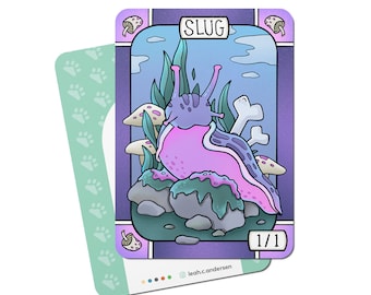 May include: A purple and pink slug with a blue shell sits on a rock in a green and blue underwater scene. The card is titled "SLUG" and has a 1/1 power rating. The card is from the "leah.c.andersen" collection.