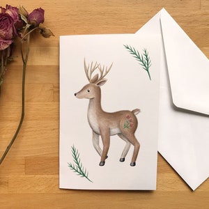 Carte de voeux Chevreuil et branches de sapin, illustration au crayon de bois dessiné à Montréal, Québec