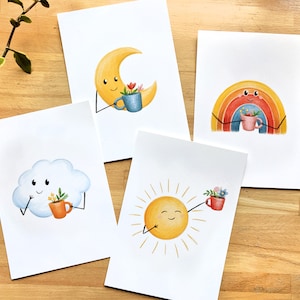 Ensemble de 4 Cartes Postales ou Affichettes 5 x 7, Soleil, Lune, Arc-en-ciel, Nuage avec tasse remplie des fleurs, illustré à Montréal