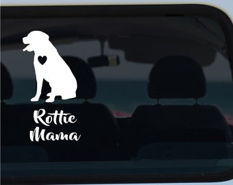 May include: White vinyl decal of a Rottweiler silhouette with a heart on its chest, on a blue and white van. The decal reads "Rottie Mama".