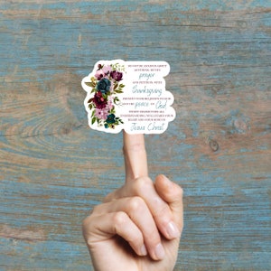 May include: A sticker with a floral design and a quote from the Bible: "Do not be anxious about anything, but by prayer and petition, with thanksgiving present your requests to God. And the peace of God, which transcends all understanding, will guard your heart and your mind in Christ."