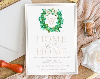 May include: A housewarming party invitation with a green wreath and the text "Home Sweet Home." The invitation is on a white background with a gold border. An envelope, flowers, and a wax seal are also present.