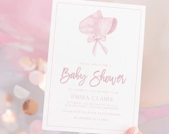 May include: A pink baby shower invitation with a watercolor bonnet illustration and the words "Baby Shower" in cursive. The invitation includes details for Emma Claire's baby shower, held on August 2nd.