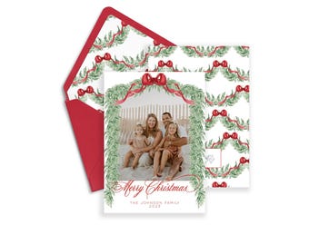 May include: A Christmas card featuring a family of four in front of a decorated wreath with a red bow. The card reads "Merry Christmas" and "The Johnson Family 2023".
