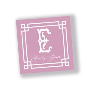 May include: A square, light purple card with a white decorative border and a white letter "E" in the center. The name "Emily Jones" is written in cursive below the letter.