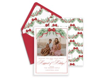 May include: A Christmas card set with a family photograph, a red envelope, and a matching card design. The card has a red border and the text reads "Wishing you and your family the Happiest of Holidays!" with the family name and year.