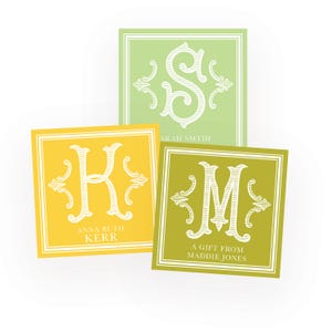 May include: Three square personalized gift tags in shades of yellow, green, and lime. Each tag features a white monogram letter and name, with a decorative border. One tag reads "A Gift From Maddie Jones."