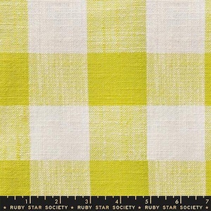 May include: Close-up of a fabric with a large gingham pattern. The design features alternating squares of bright chartreuse and off-white. The fabric has a textured appearance, suggesting a linen or cotton weave. The text "RUBY STAR SOCIETY" is at the bottom.