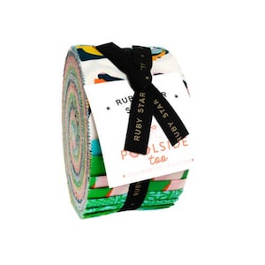 May include: A white ceramic mug with a black handle and the text "But First, Coffee" in a bold, black font. The mug is set against a blurred background, suggesting a cozy setting.