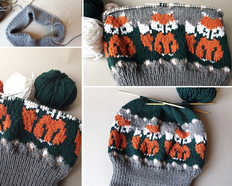 K&ouml;nnte beinhalten: Eine Strickm&uuml;tze im Entstehungsprozess mit einem sich wiederholenden Muster aus orangefarbenen F&uuml;chsen auf grauem und gr&uuml;nem Hintergrund. Stricknadeln und verschiedenfarbige Garne, darunter Wei&szlig; und Dunkelgr&uuml;n, sind zu sehen.