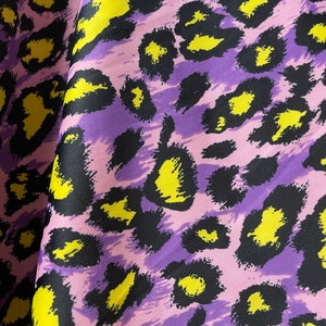 Cheetah print on nylon spandex fabric 4 way Stretch. Sold by the yard. Animal print( leopard print)