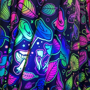 New Mushrooms  trippy UV glow neon print on great quality of nylon spandex 4-way stretch 60” wide. Sold by the yard