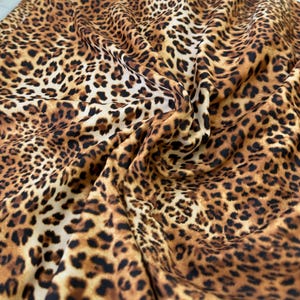 New Cheetah print on nylon spandex fabric 4 way Stretch. Sold by the yard. Animal print( leopard print)