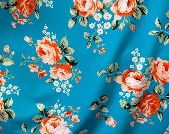 New Peach Floral Flower on Turquoise Spandex fabric 4 way stretch 60” wide. Sold by yard. Ships worldwide from Los  Angeles CA