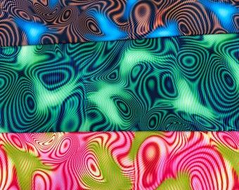 May include: Three fabric swatches with abstract patterns. The top swatch is blue and orange, the middle is green, and the bottom is pink and yellow. Each fabric has a wavy, swirling design.