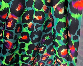 NEW Cheetah print on Green tie dye nylon spandex fabric 4 way Stretch. Sold by the yard. Animal print( leopard print)