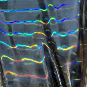 Black Iridescent stripes foil stretch latex fabric 4 way stretch 60” wide. Sold by yard. Ships worldwide from Los  Angeles CA