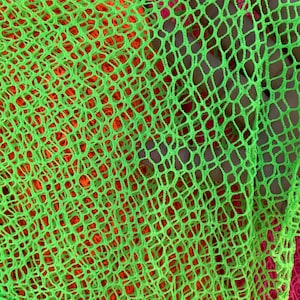 New Fishnet neon colors 4 way Stretch poly fishnet 4 colors available. Fabric sold by yard 60”wide